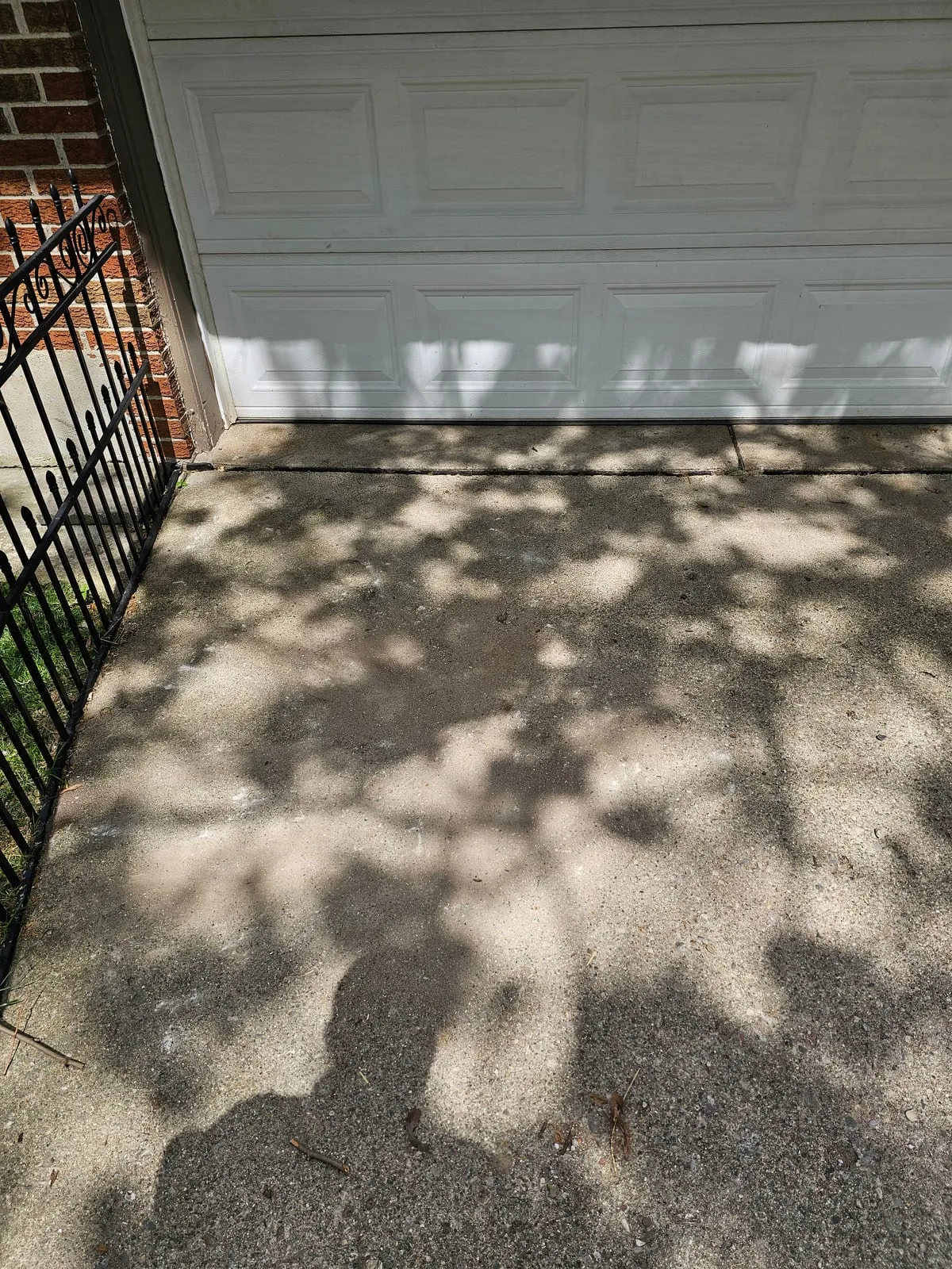 The same driveway swept clear and empty
