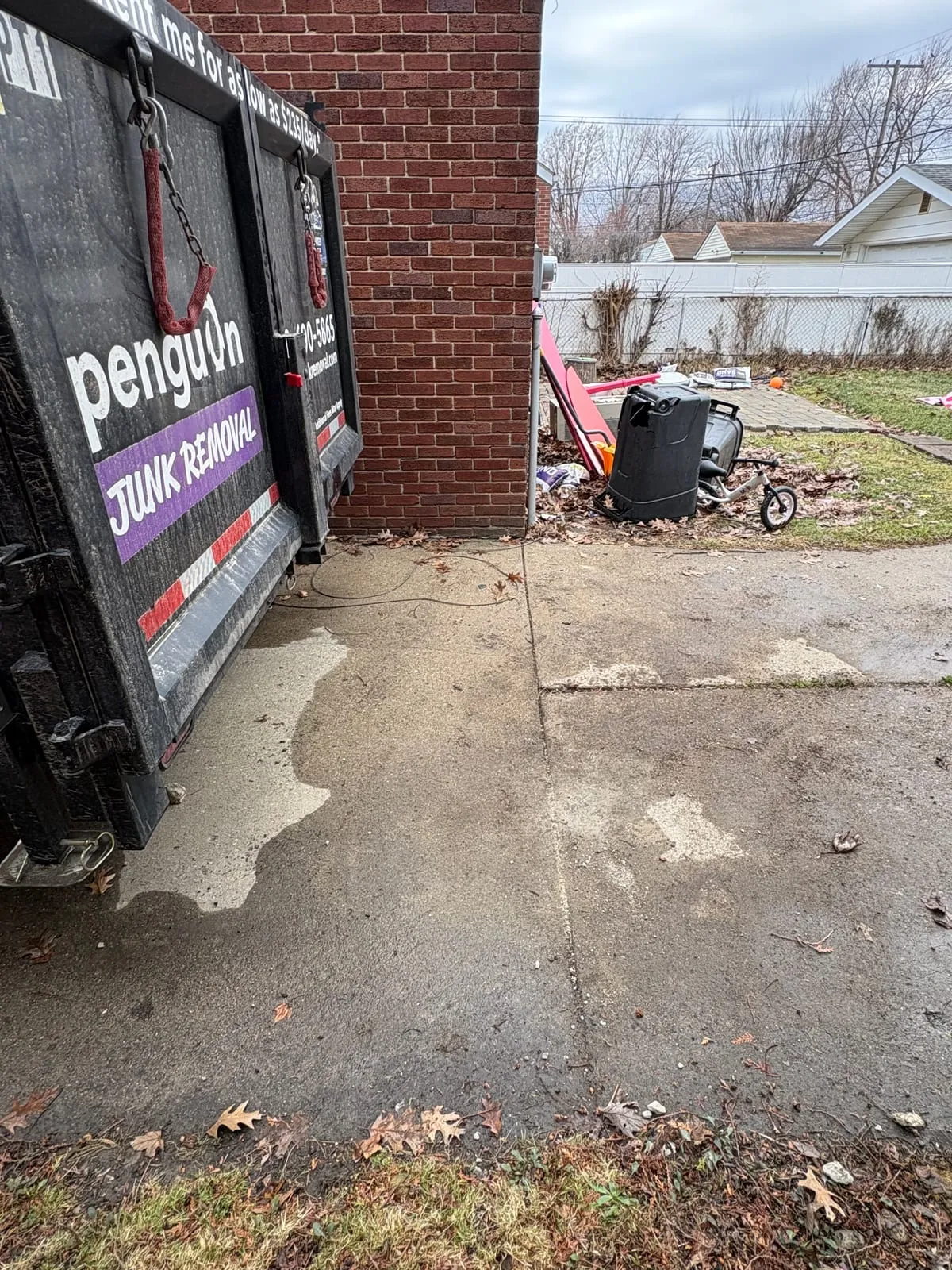The same driveway cleared, with the Penguin trailer alongside