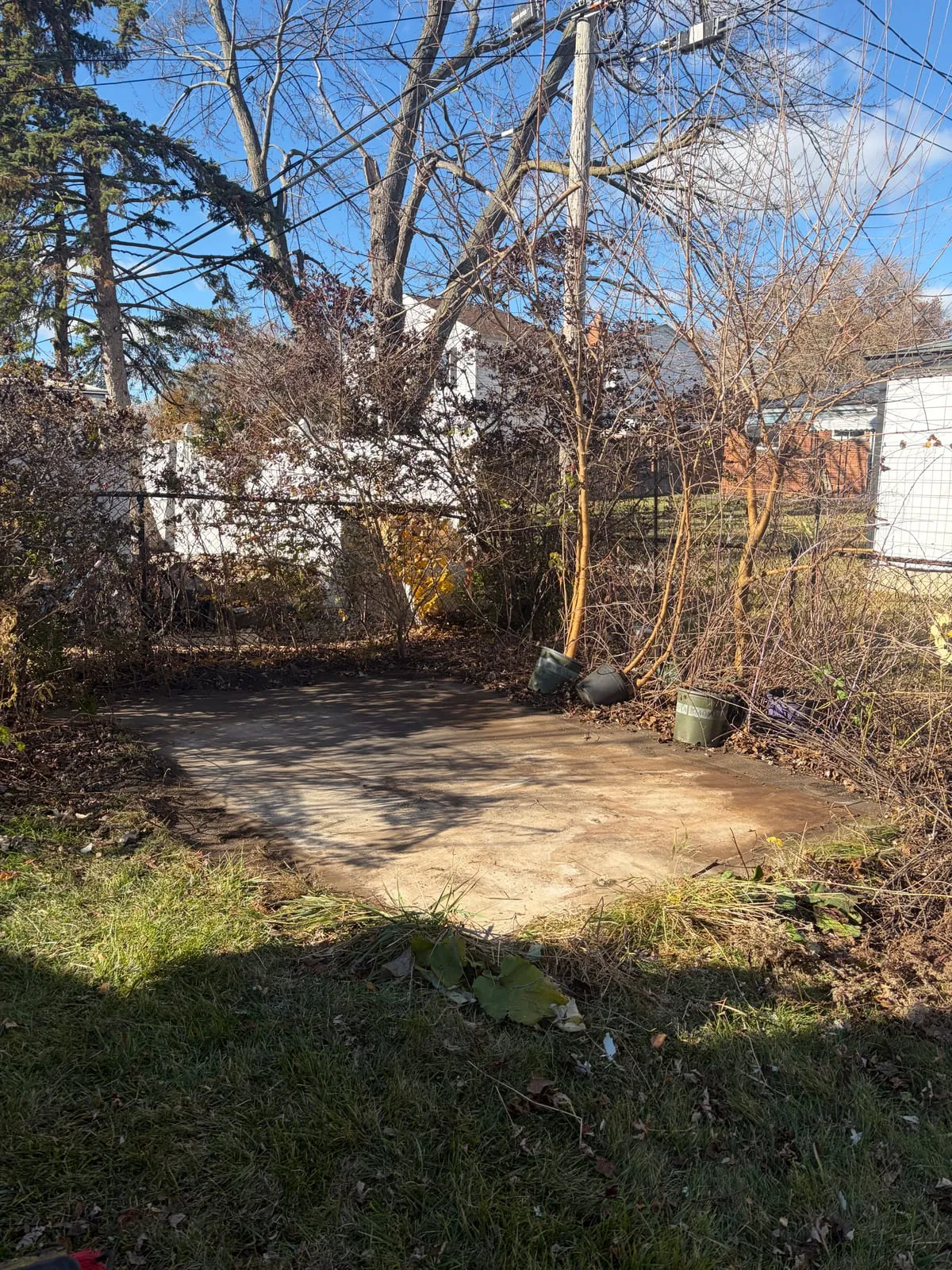 The same backyard with the shed gone, leaving clear open grass