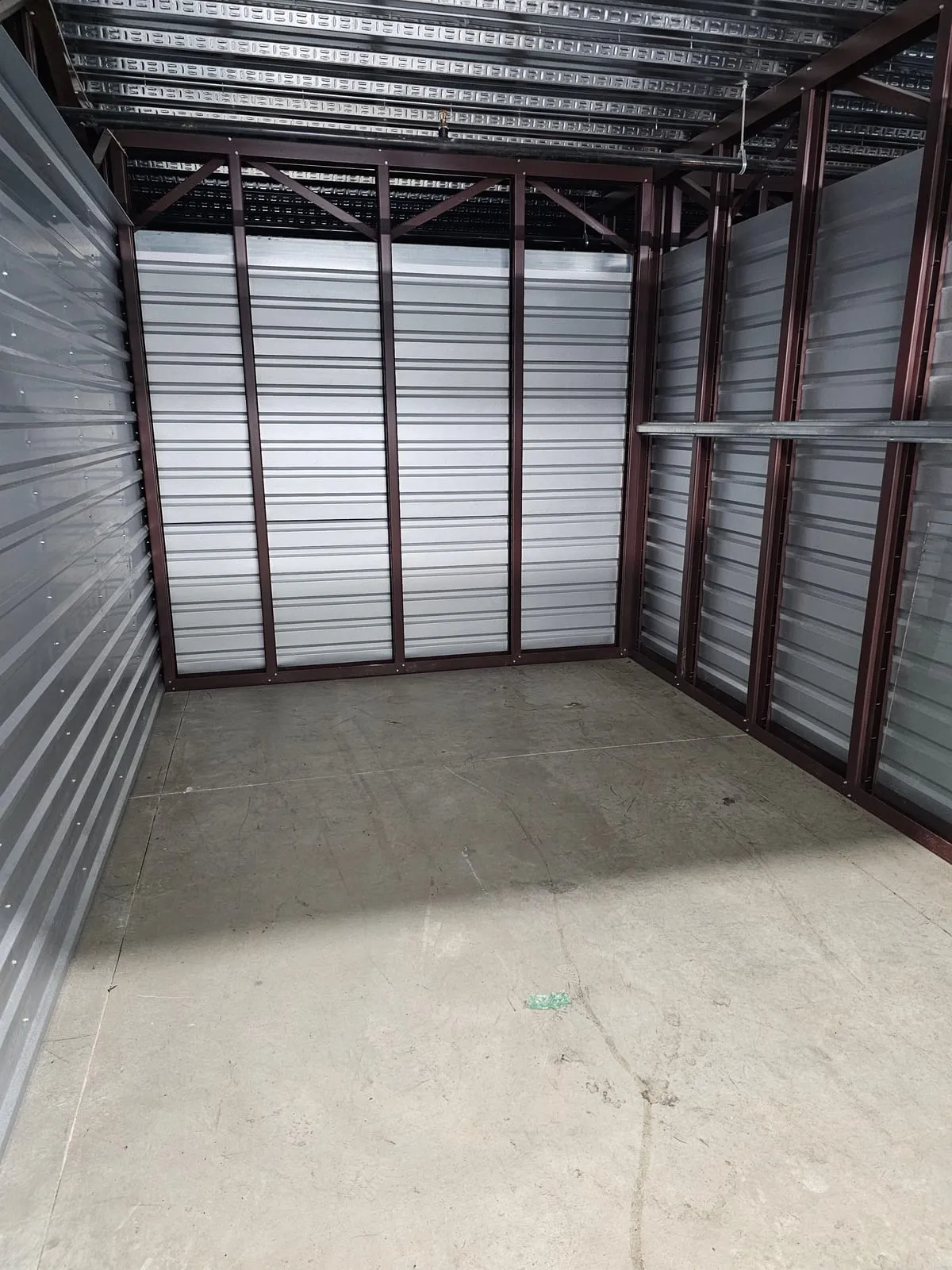 The same storage unit emptied to bare floor